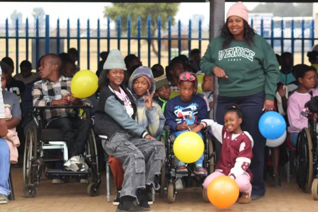 Learners with disabilities celebrating with balloons at Boiteko Special School