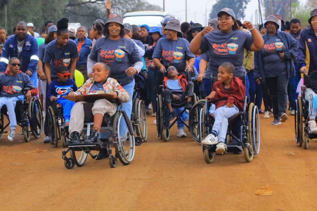 Learners and supporters moving together during the fun walk