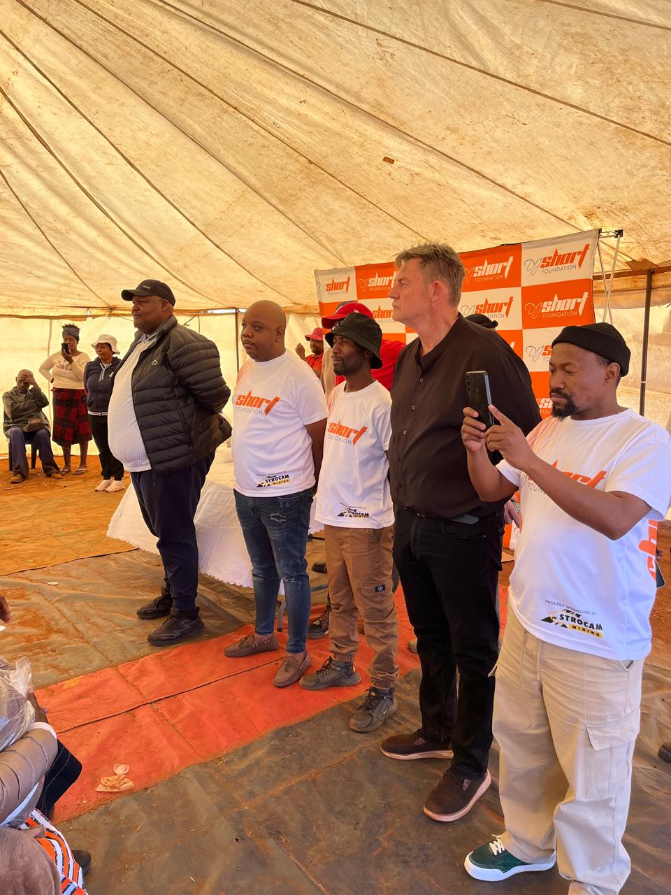 Foundation representatives addressing guests at the Nelson Mandela Day celebration