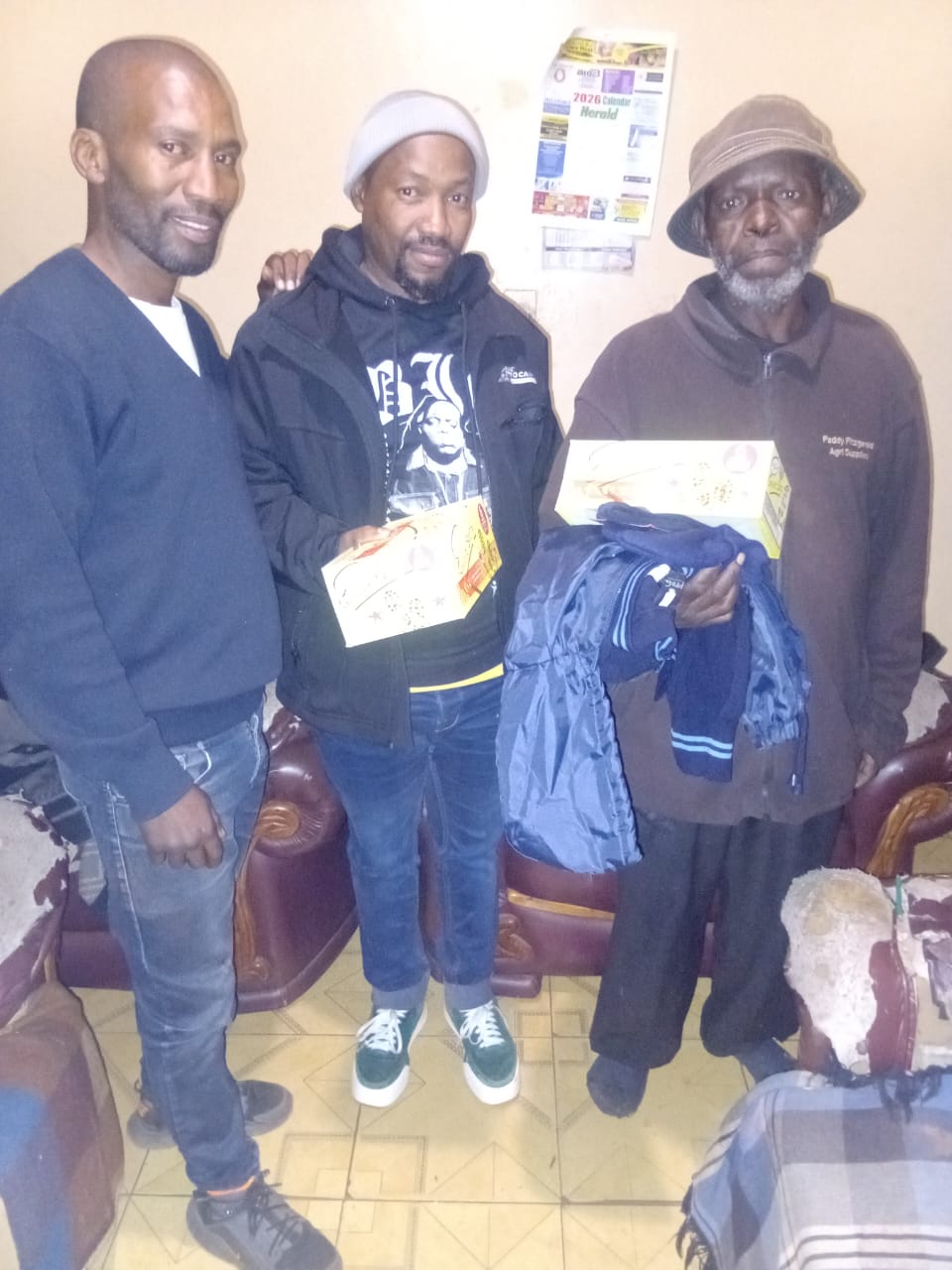 DJ Short Foundation delivering uniform and shoes to a father at his home