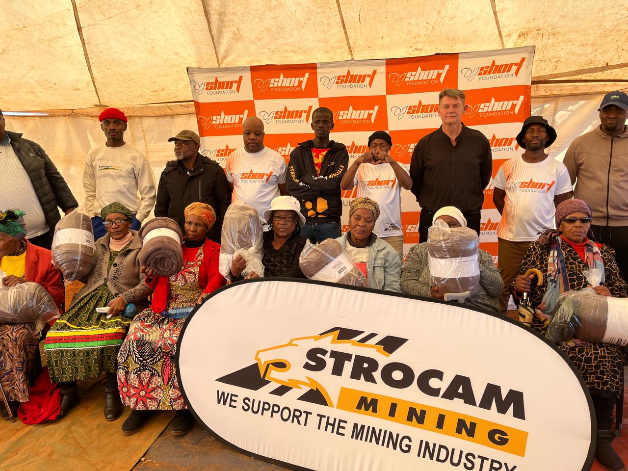 DJ Short Foundation team and elderly community members with donated blankets